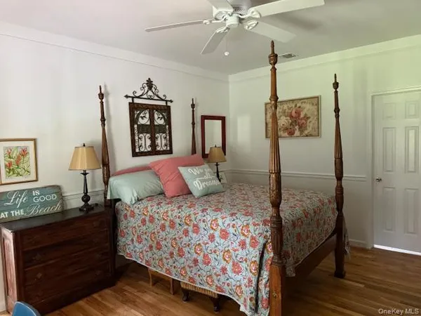 a bedroom with a bed and a table