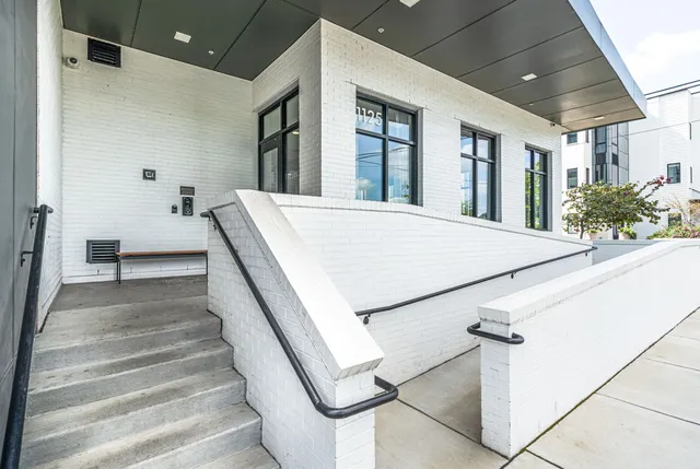 a kitchen with stainless steel appliances a stove a sink and a microwave