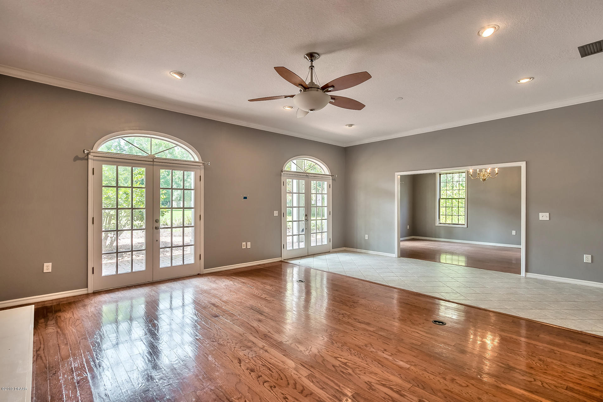 425 South Country Club Road Lake Mary, FL 32746 - Photo 7 of 32 a view of an empty room with window and wooden floor