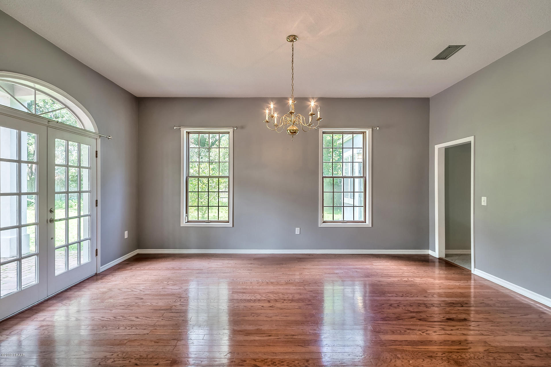 425 South Country Club Road Lake Mary, FL 32746 - Photo 8 of 32 a view of an empty room with window and wooden floor