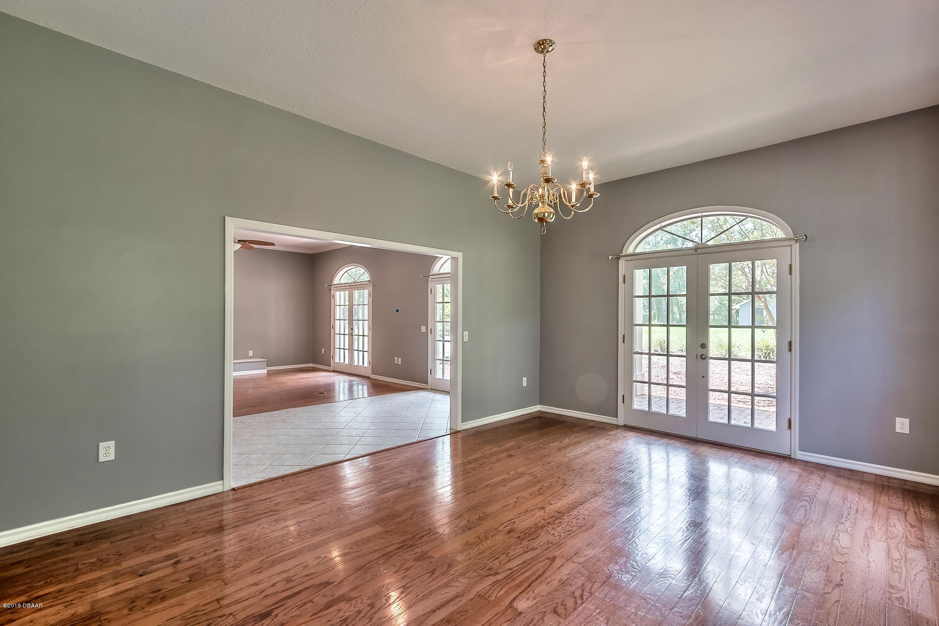 425 South Country Club Road Lake Mary, FL 32746 - Photo 9 of 32 a view of an empty room with wooden floor and a window