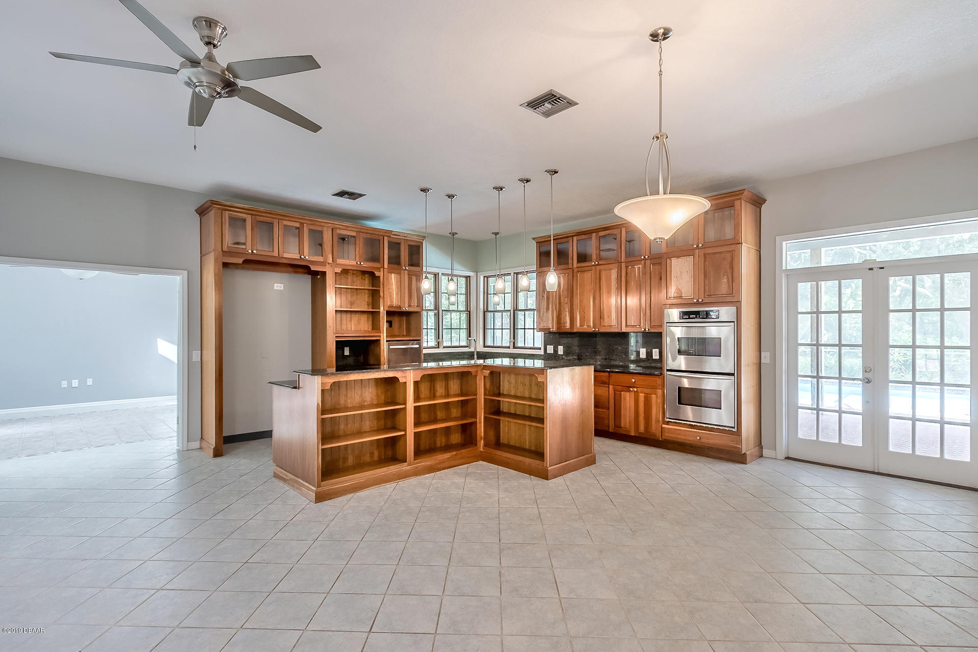 425 South Country Club Road Lake Mary, FL 32746 - Photo 10 of 32 a view of an empty room with kitchen and a window