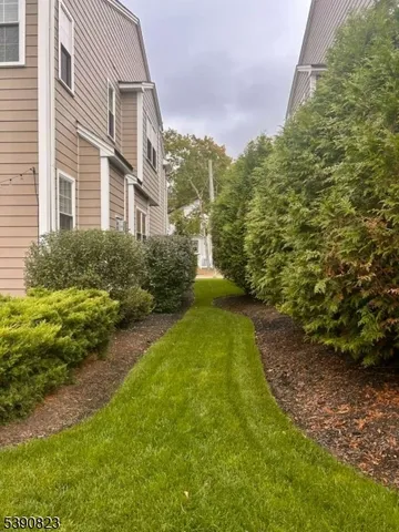 a view of a yard in front of a house