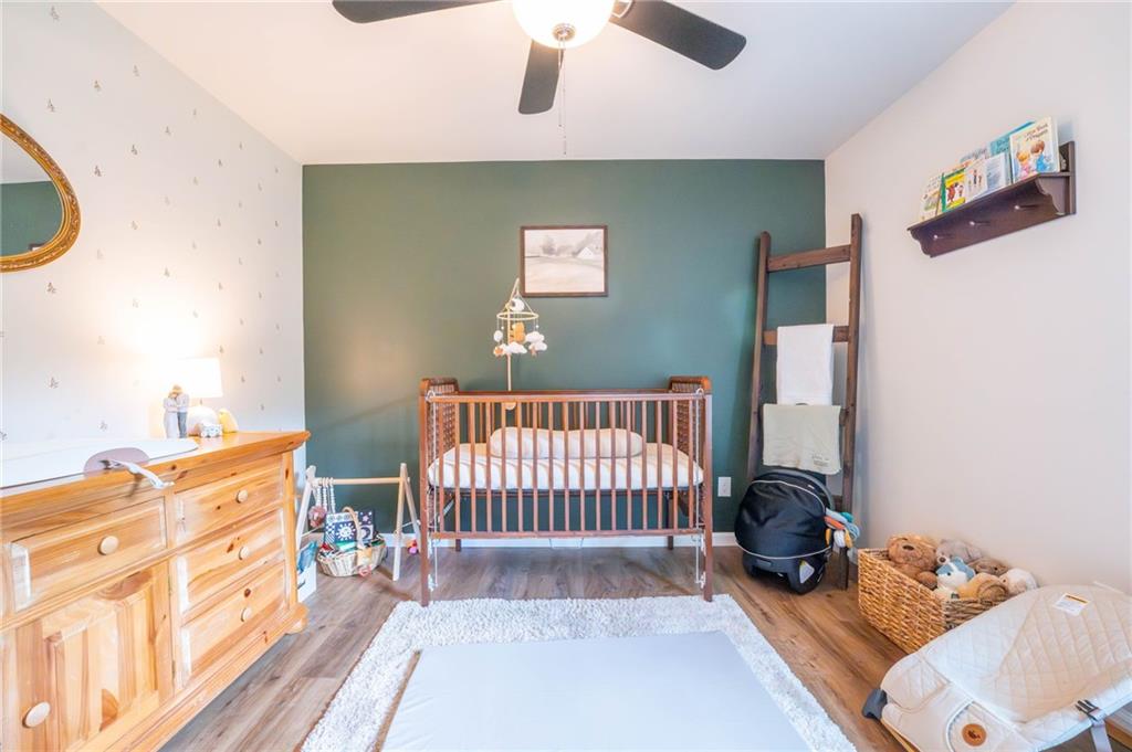 118 Wash Rider Road Dahlonega, GA 30533 - Photo 12 of 37 a bedroom with furniture and a wooden floor