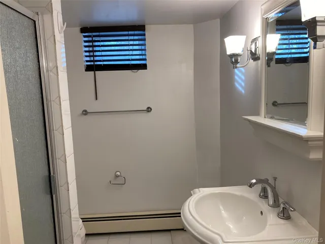 a bathroom with a sink and mirror