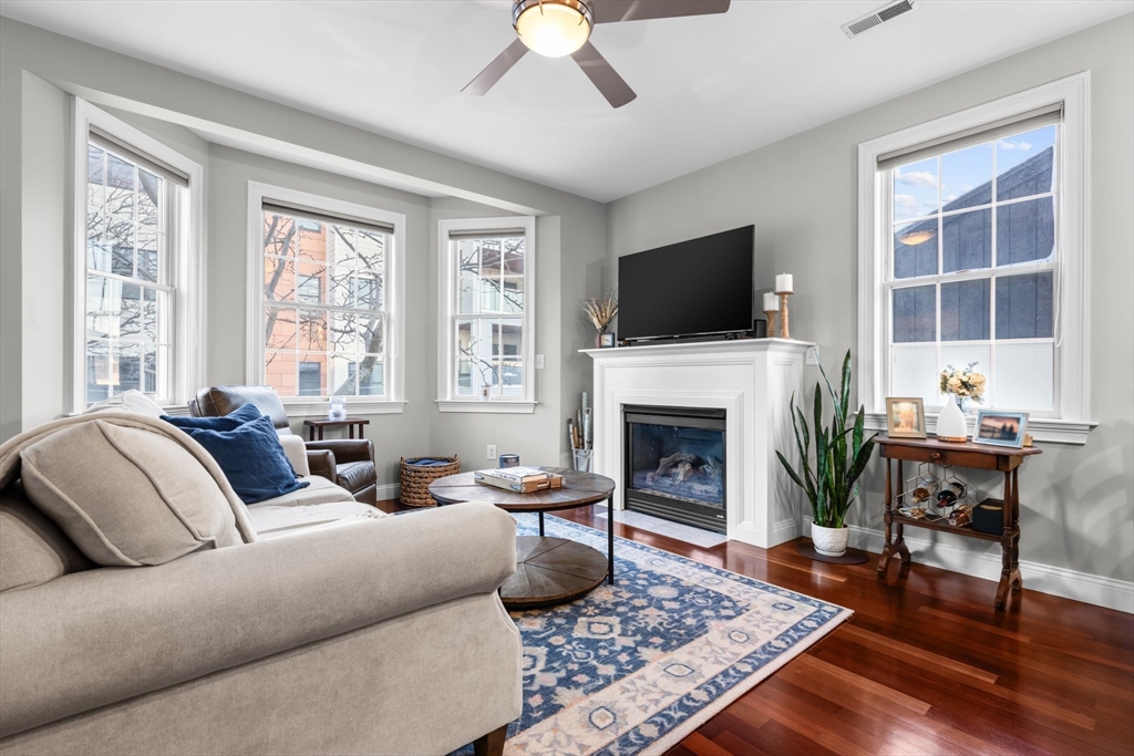 34 H Street, Unit 2L Boston, MA 02127 - Photo 4 of 20 a living room with furniture fireplace and window