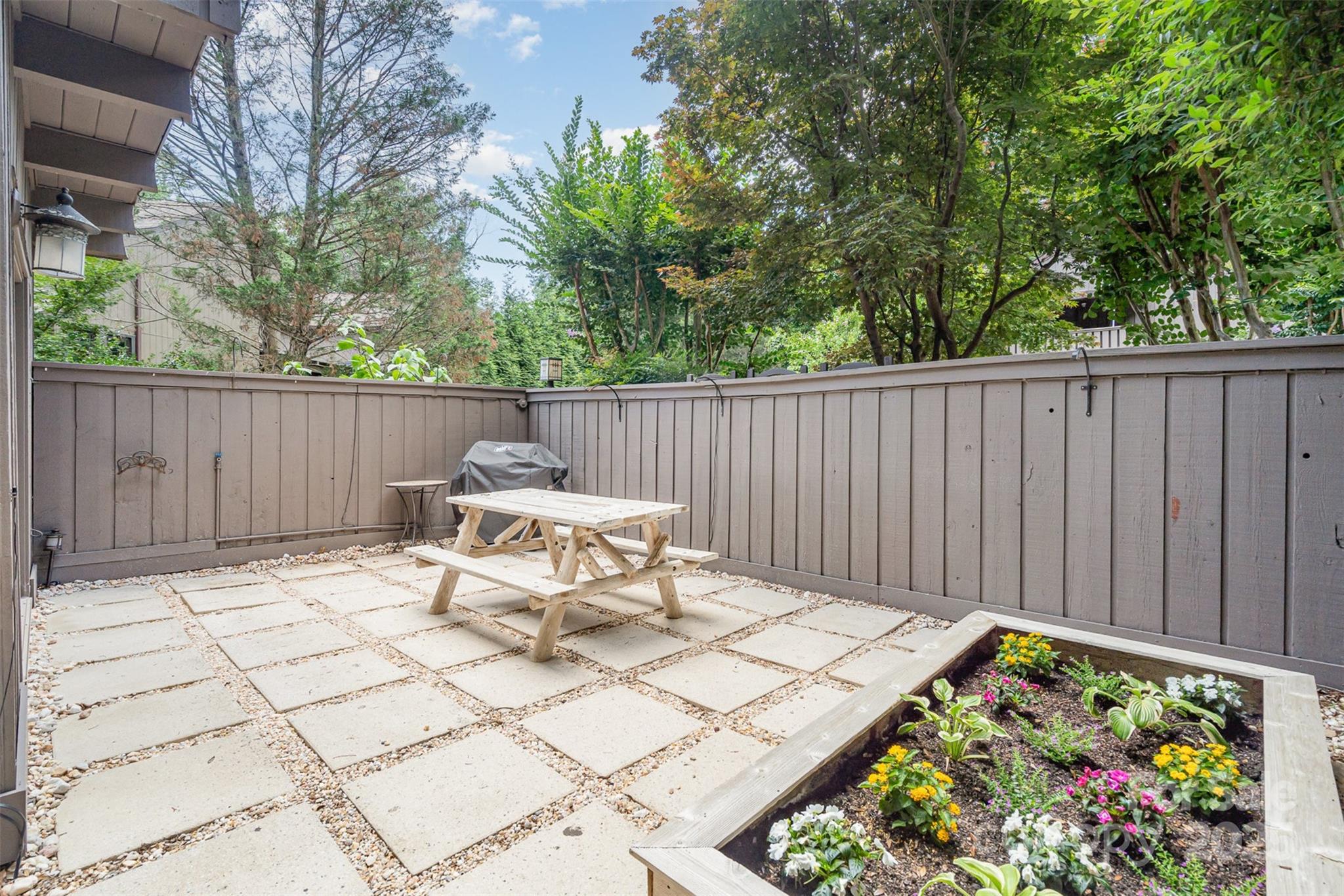 4725 Rounding Run Road Charlotte, NC 28277 - Photo 3 of 27 a view of a chairs and tables in the back yard of the house