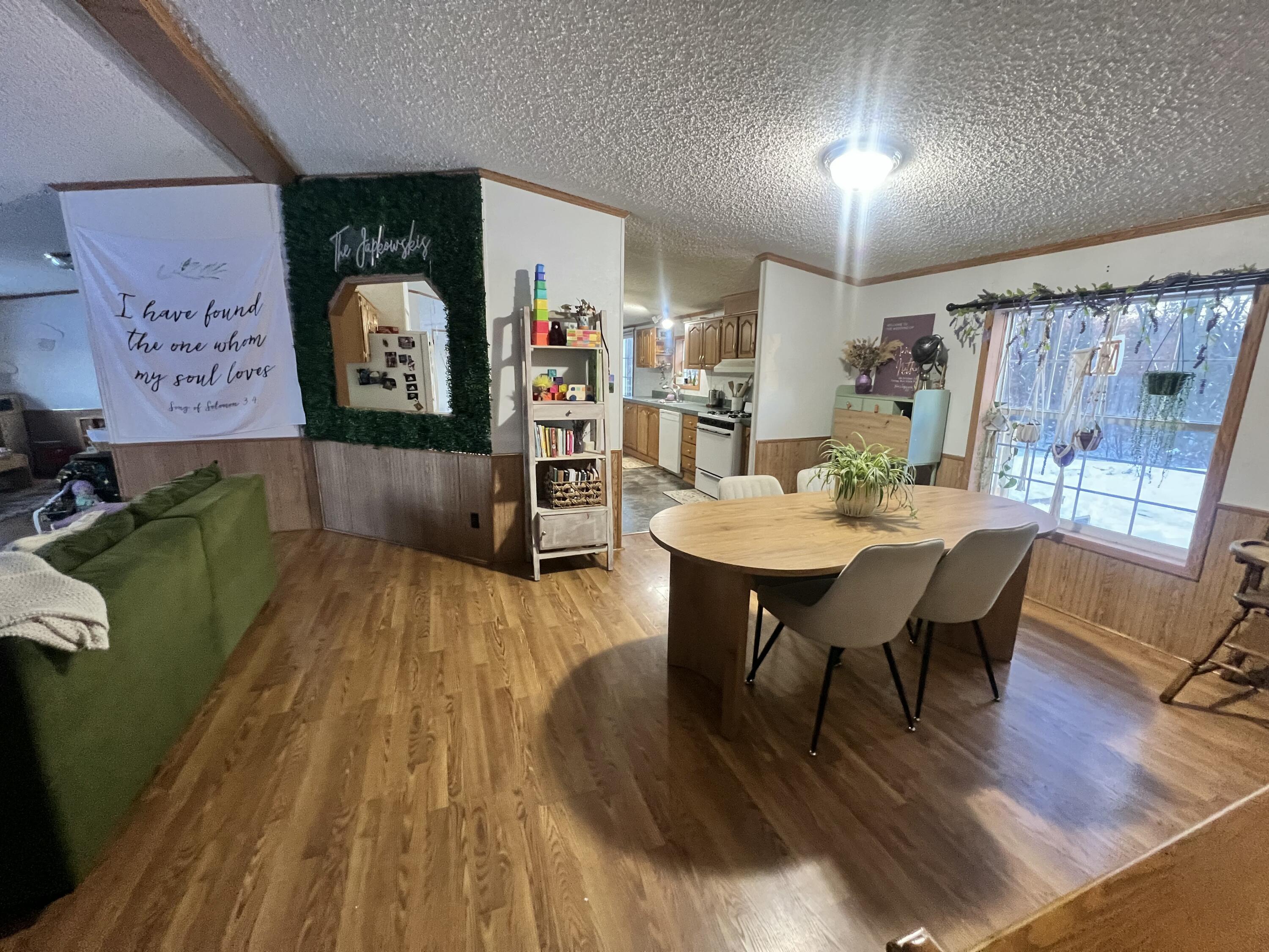 3665 Leslie Street North Judson, IN 46366 - Photo 11 of 39 a view of a dining room with furniture and wooden floor