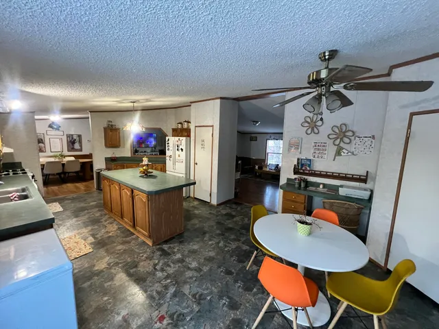 a kitchen with a table and chairs in it