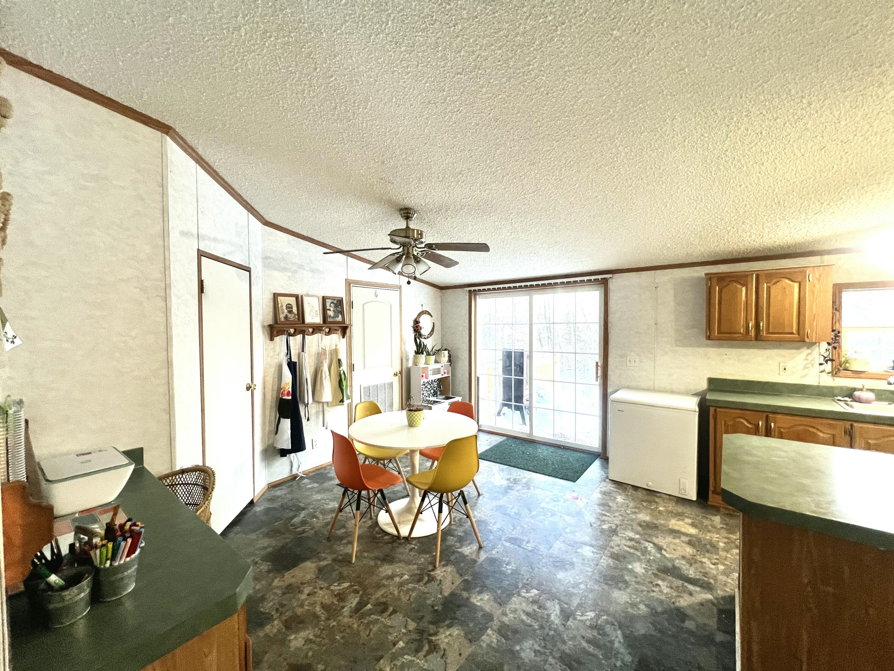 3665 Leslie Street North Judson, IN 46366 - Photo 16 of 39 a living room with furniture a rug and white walls