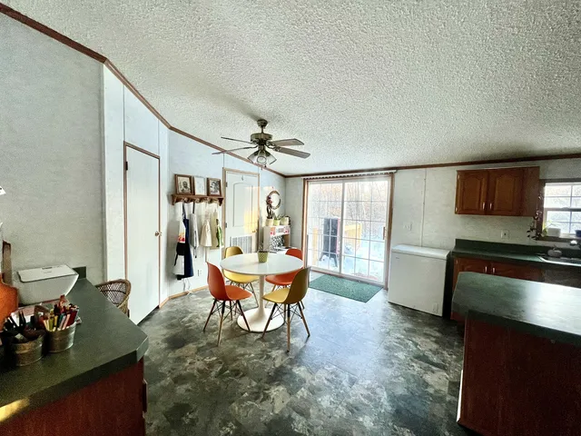 a dining room with furniture and wooden floor