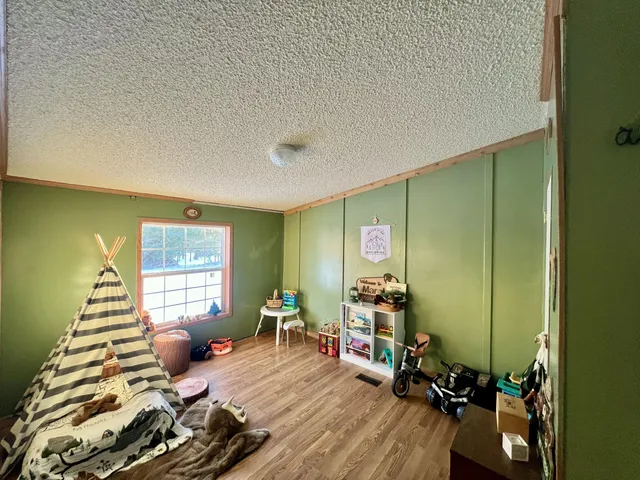 a room with furniture and a wooden floor
