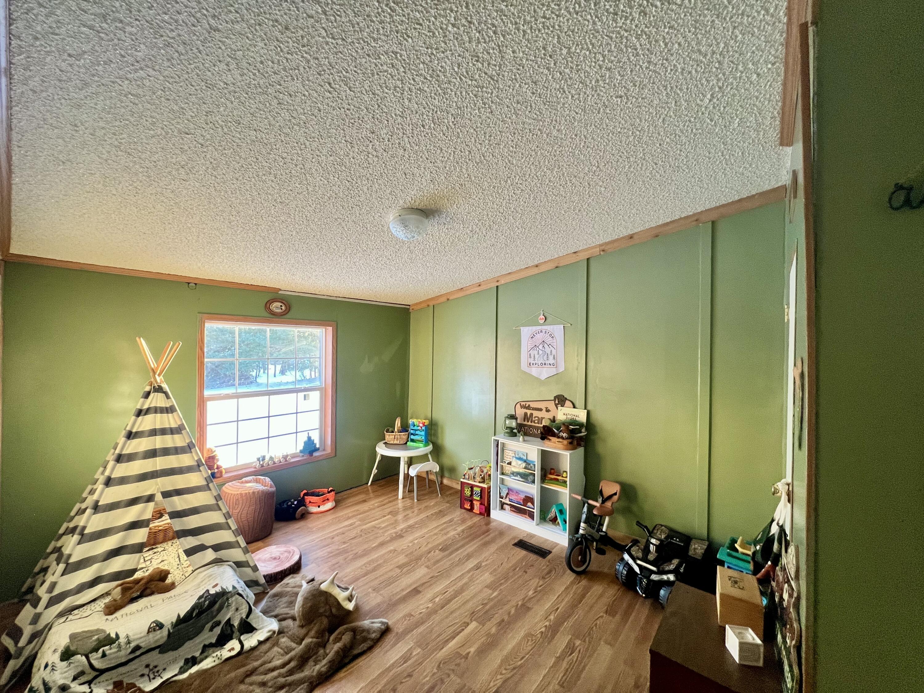 3665 Leslie Street North Judson, IN 46366 - Photo 21 of 39 a room with furniture and a wooden floor