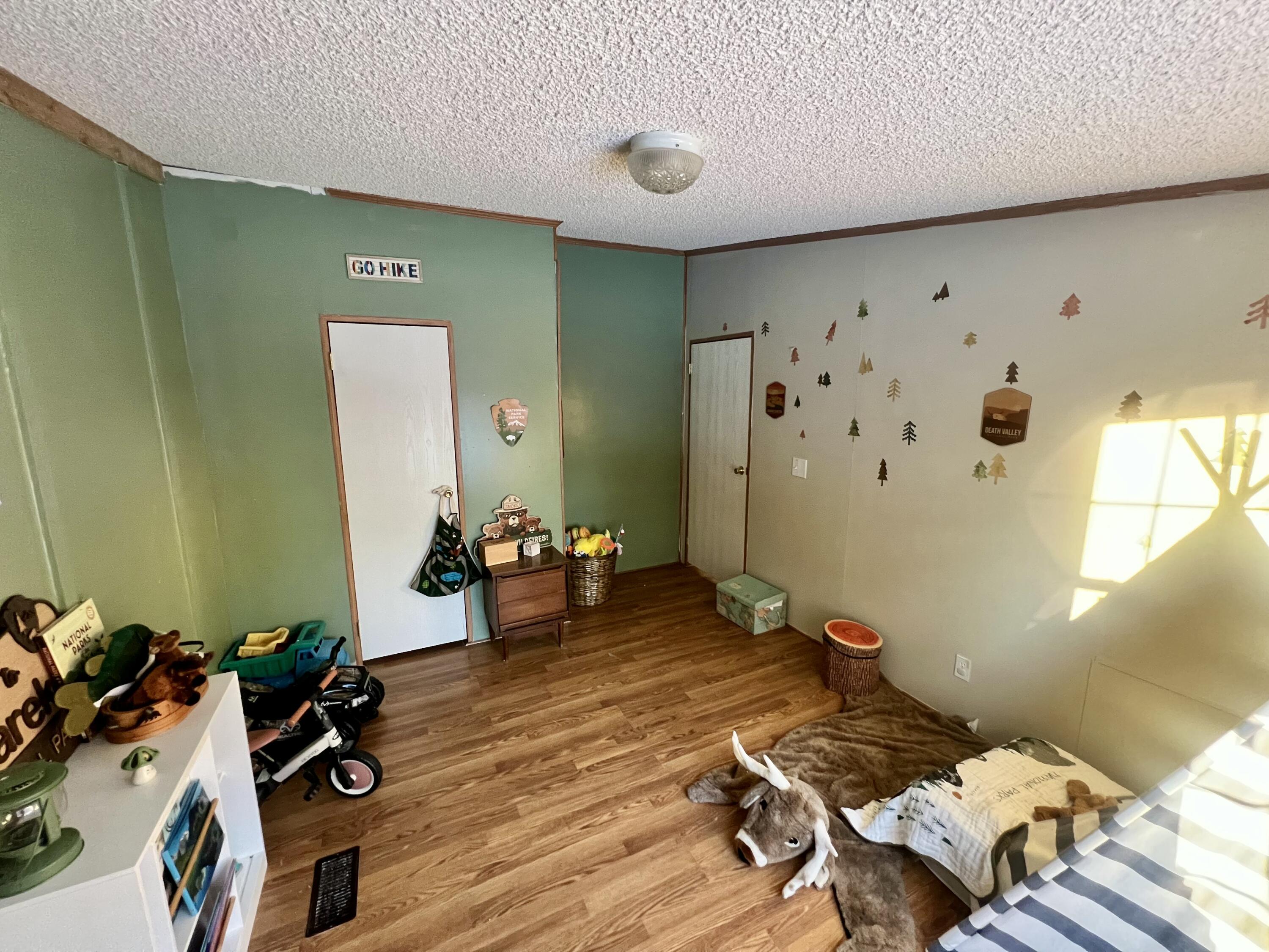 3665 Leslie Street North Judson, IN 46366 - Photo 22 of 39 a living room with furniture and wooden floor