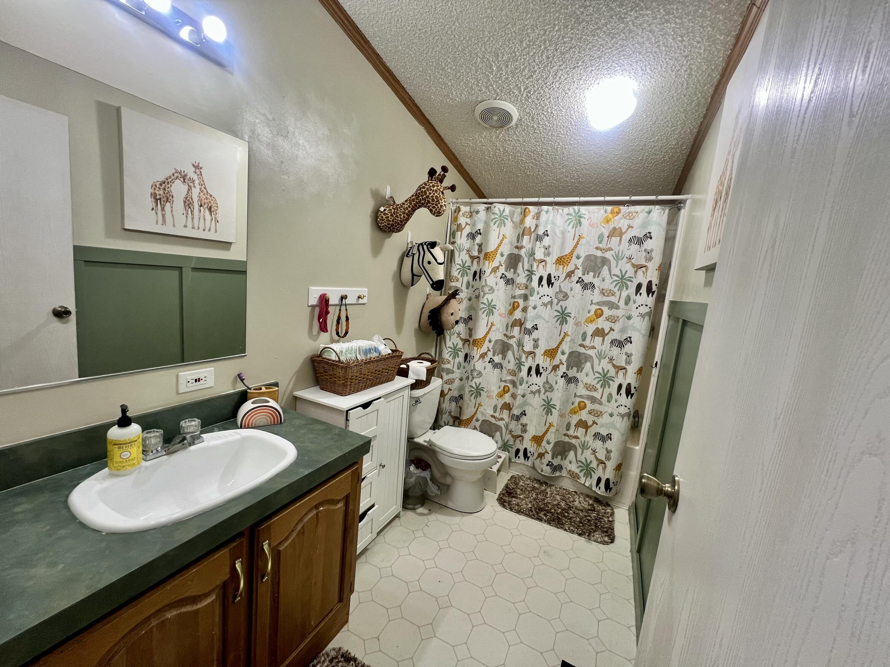 3665 Leslie Street North Judson, IN 46366 - Photo 23 of 39 a bathroom with a sink toilet and shower