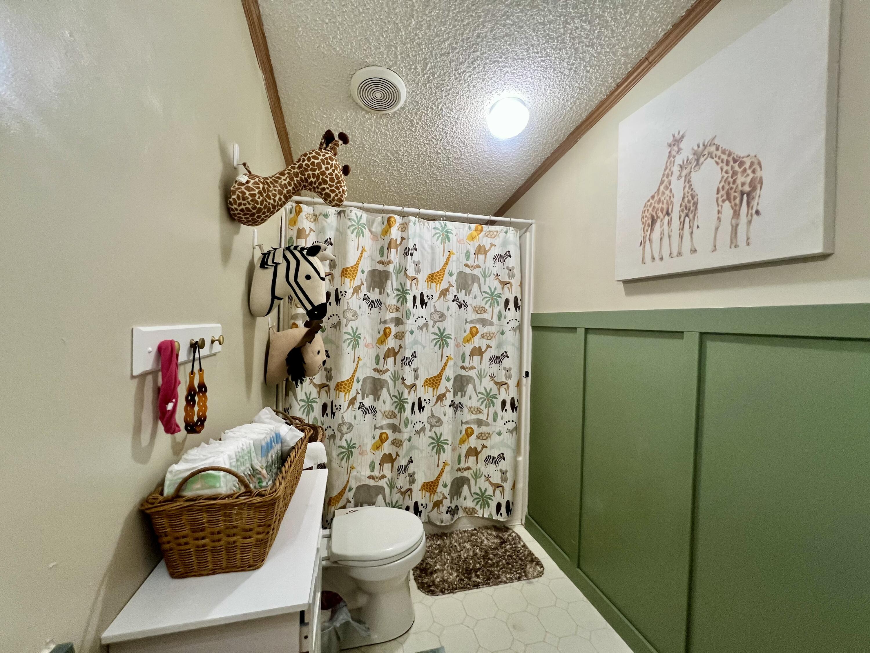 3665 Leslie Street North Judson, IN 46366 - Photo 24 of 39 a bathroom with a toilet sink and shower curtain