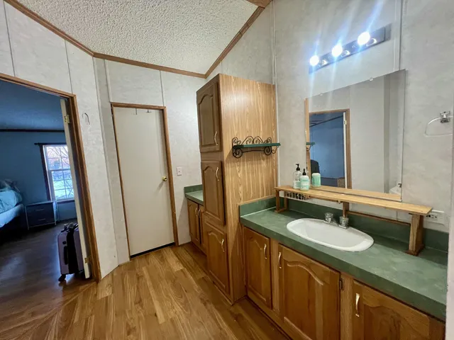 a bathroom with a sink double vanity and a mirror