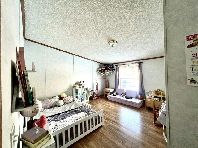 a bedroom with furniture and a window