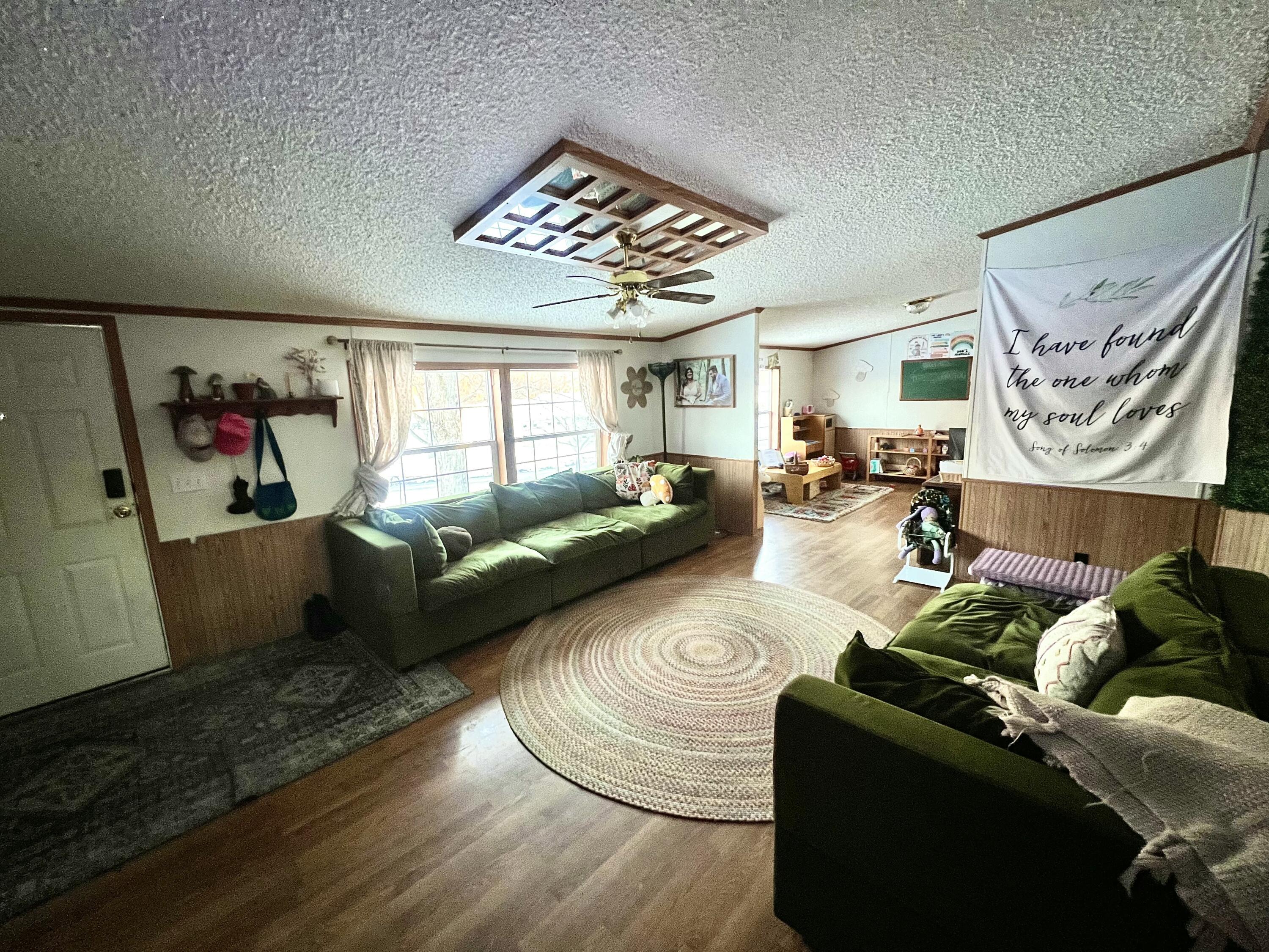 3665 Leslie Street North Judson, IN 46366 - Photo 34 of 39 a living room with furniture and wooden floor