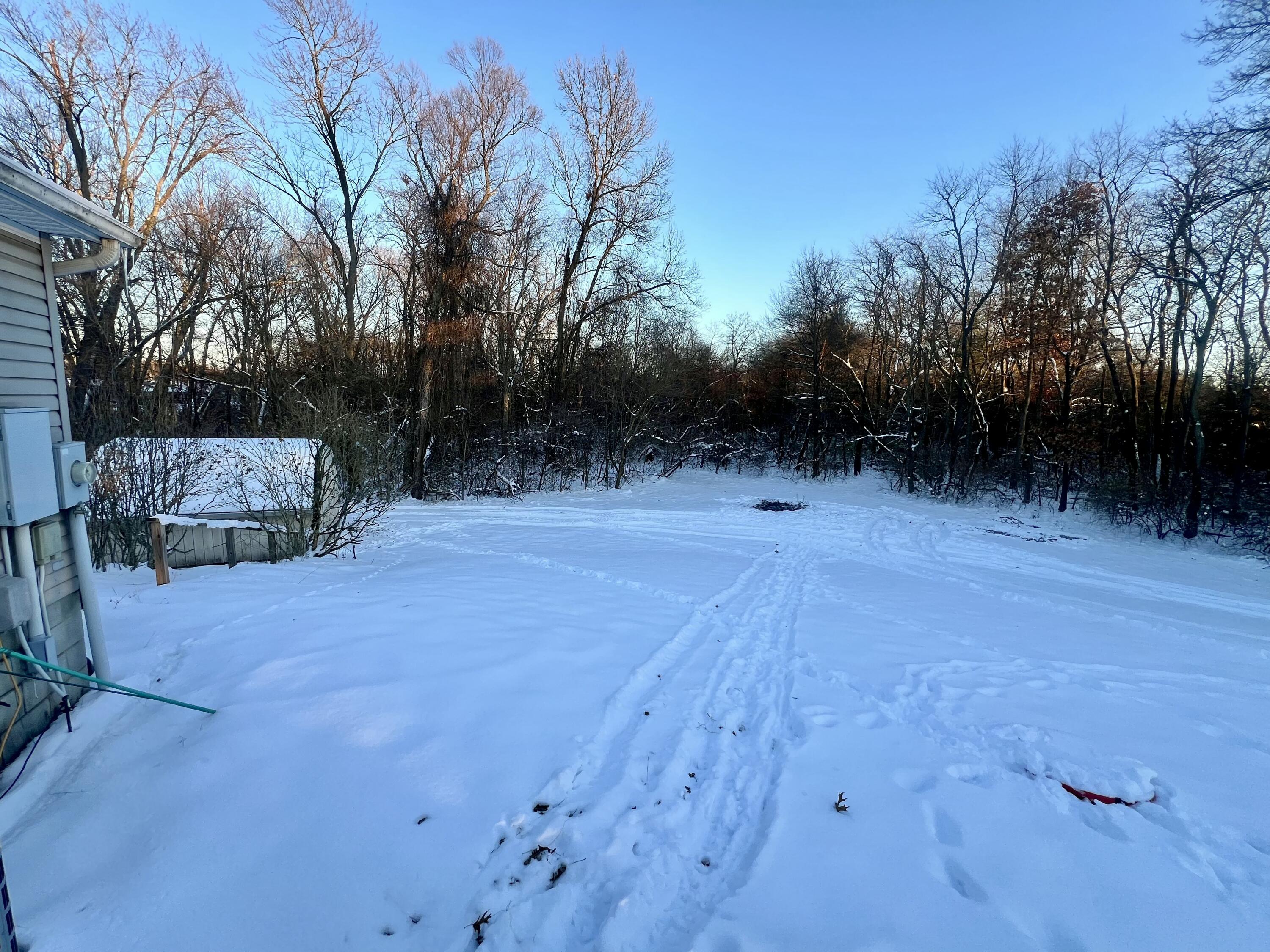 3665 Leslie Street North Judson, IN 46366 - Photo 37 of 39 a backyard of a house with lots of green space