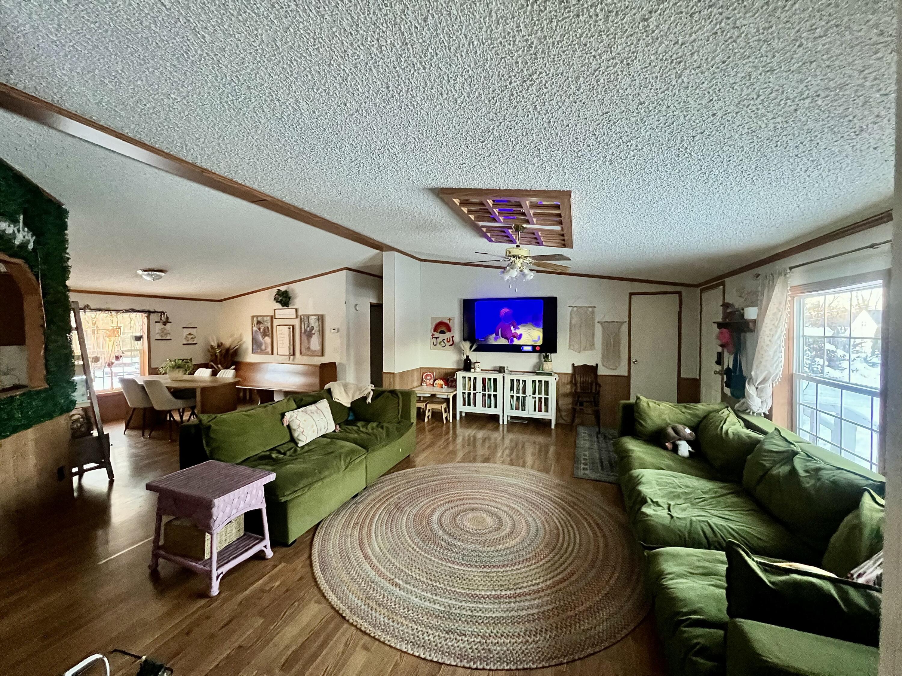 3665 Leslie Street North Judson, IN 46366 - Photo 5 of 39 a living room with furniture and a flat screen tv