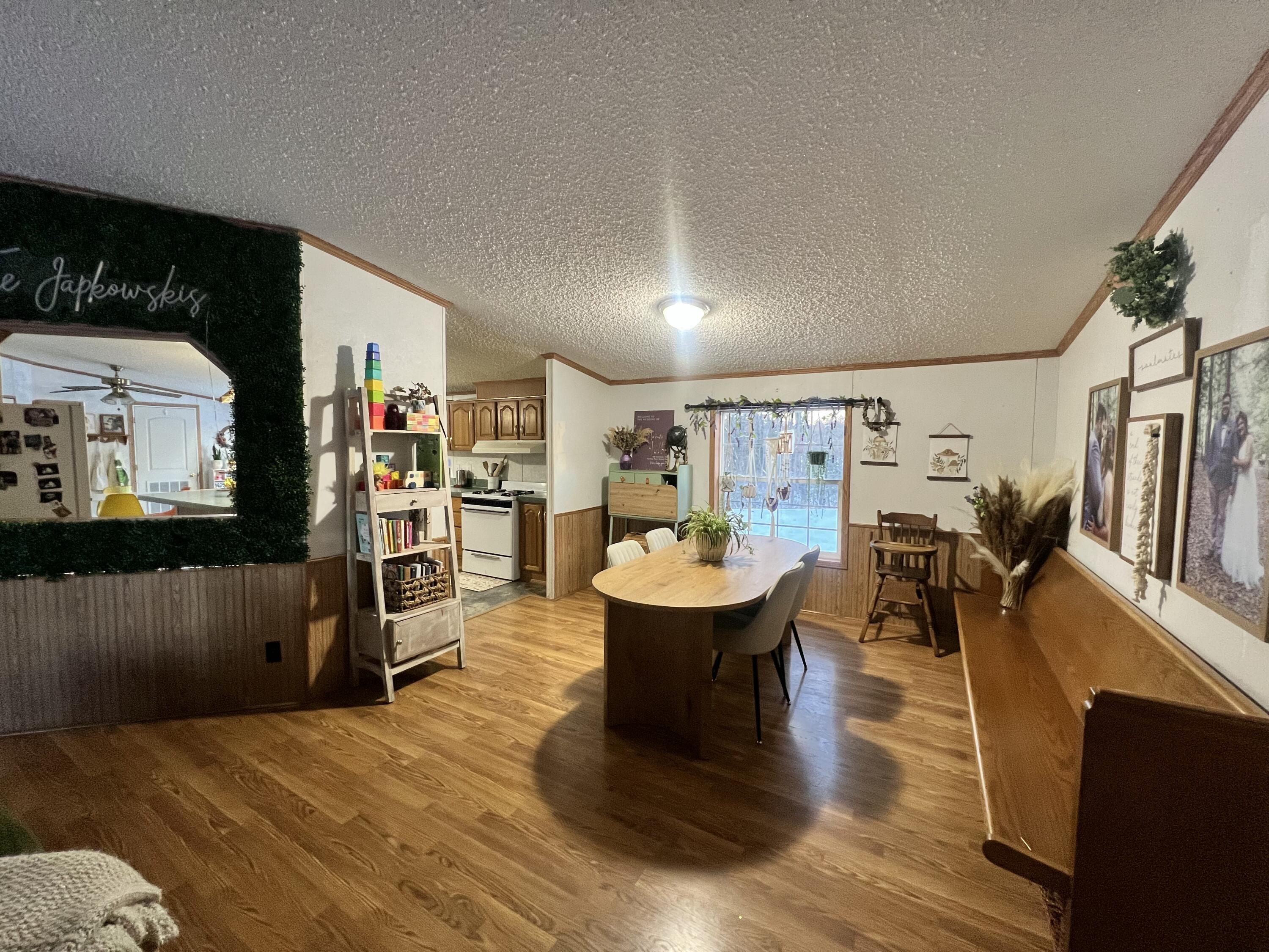 3665 Leslie Street North Judson, IN 46366 - Photo 10 of 39 a living room with furniture and a wooden floor