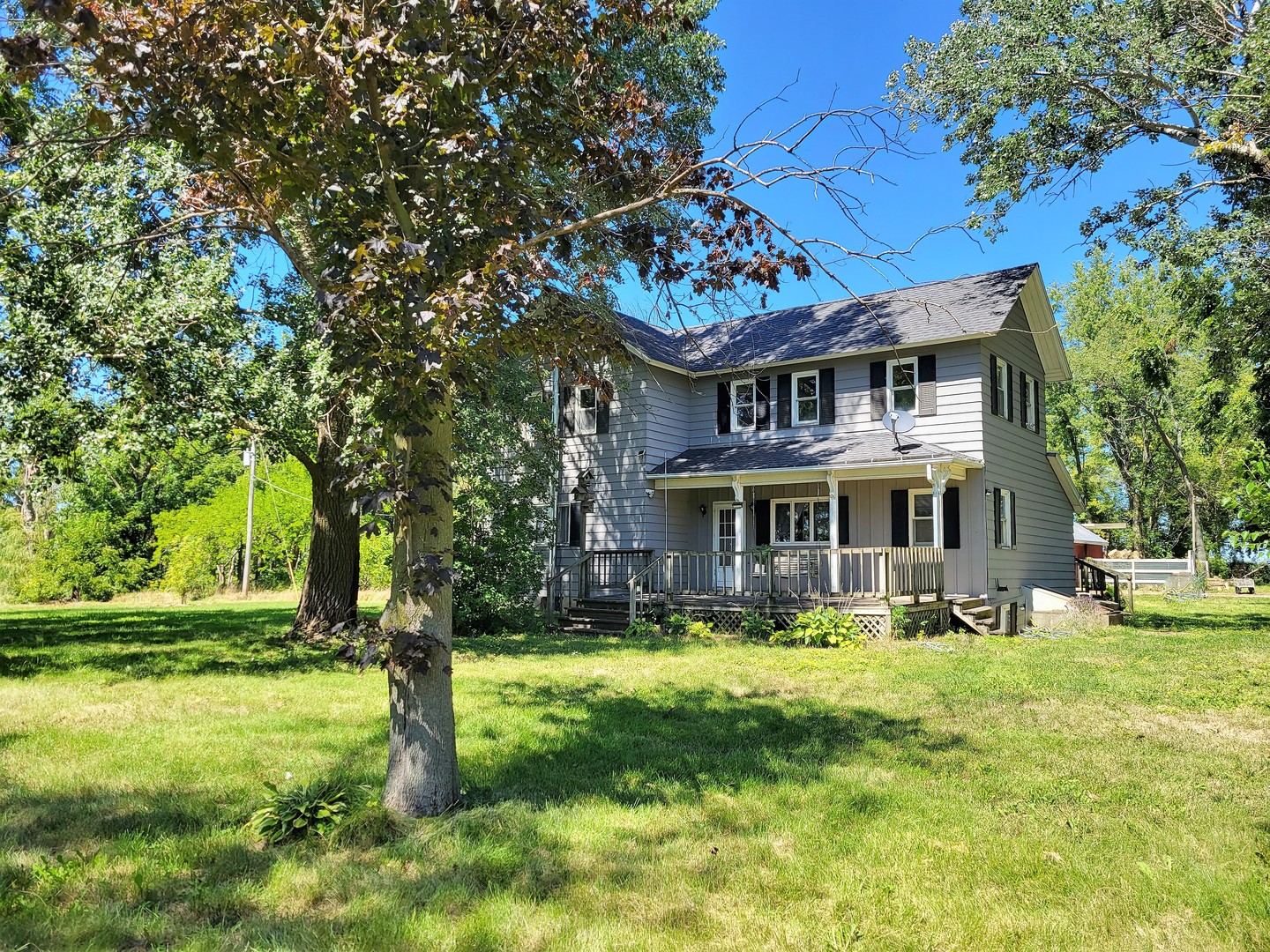 1426 Paw Paw Road Lee, IL 60530 - Photo 1 of 24 a view of a house with a big yard plants and large trees