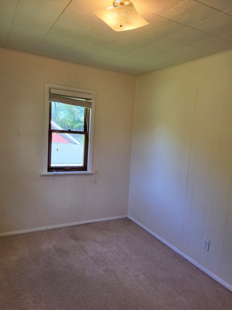 1426 Paw Paw Road Lee, IL 60530 - Photo 20 of 24 an empty room with a window