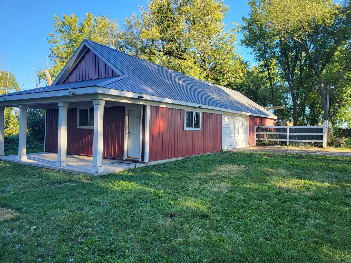 1426 Paw Paw Road Lee, IL 60530 - Photo 21 of 24 front view of a house with a yard