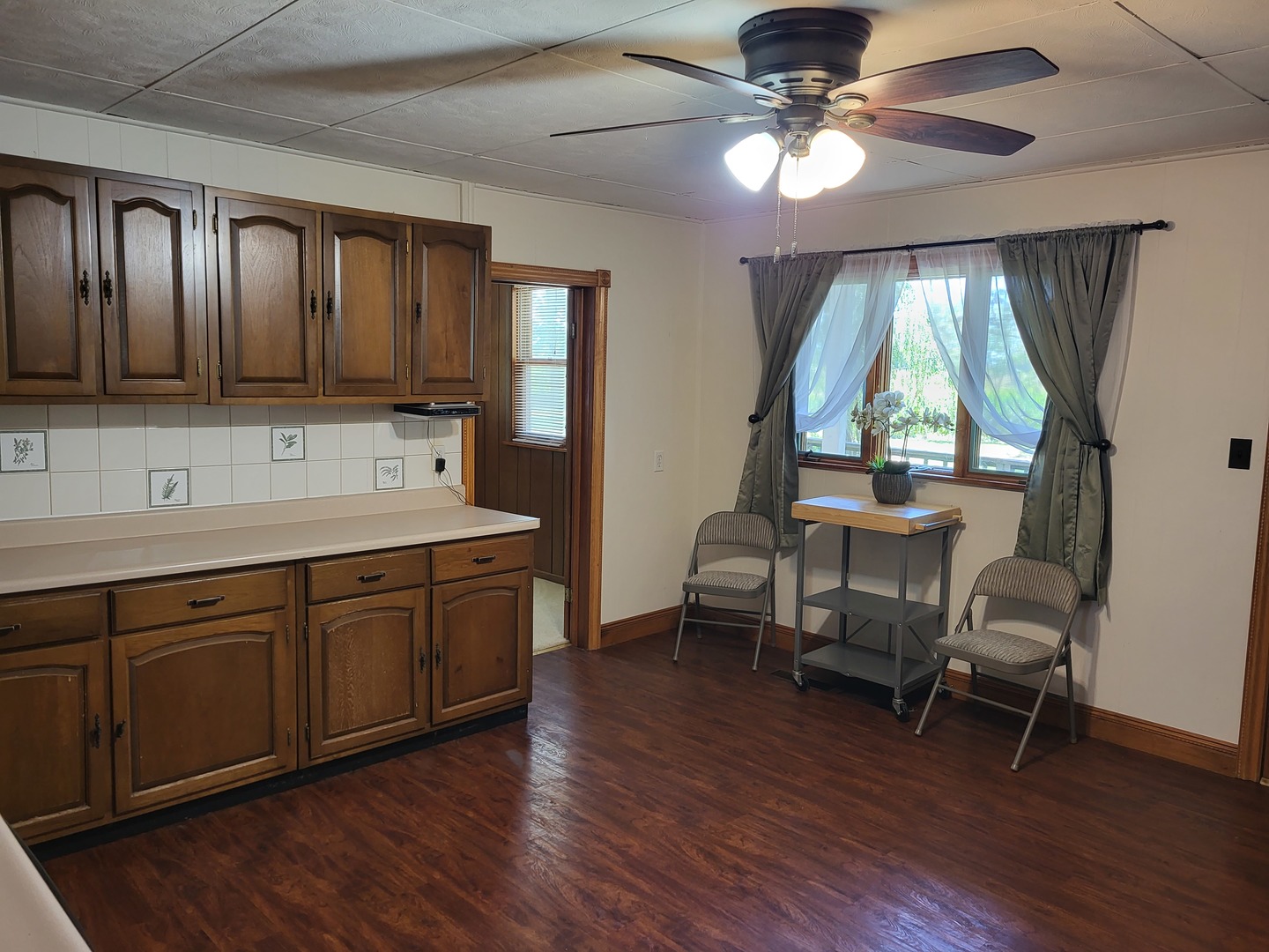 1426 Paw Paw Road Lee, IL 60530 - Photo 5 of 24 a spacious bathroom with a large window and wooden floors