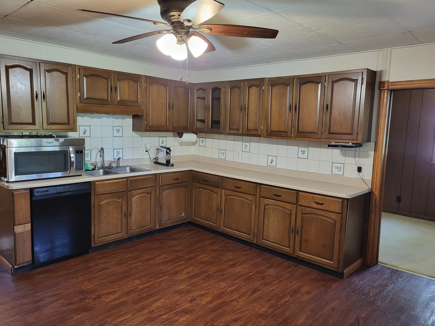 1426 Paw Paw Road Lee, IL 60530 - Photo 6 of 24 a kitchen with a sink cabinets and stainless steel appliances