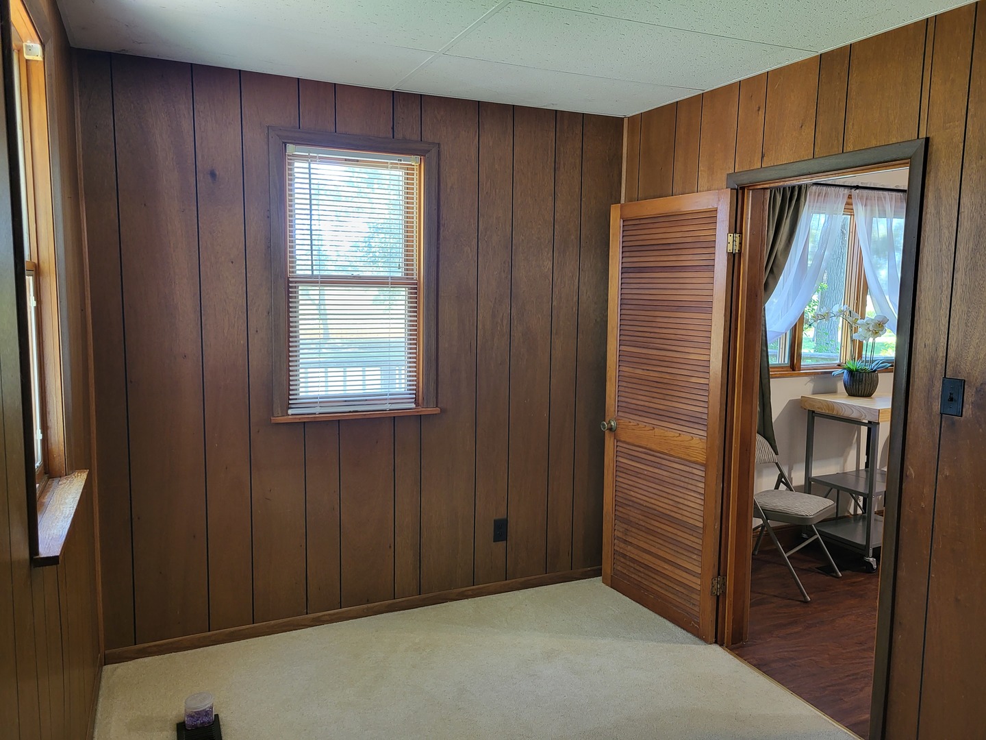 1426 Paw Paw Road Lee, IL 60530 - Photo 7 of 24 a view of an empty room with a birdcage and a window