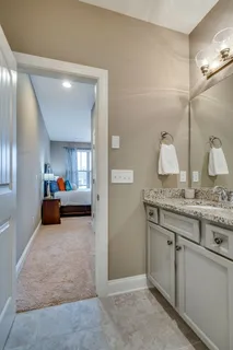 a view of a livingroom and a bathroom