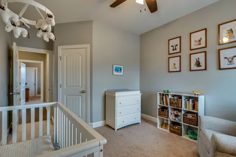 a view of a livingroom with furniture and staircase