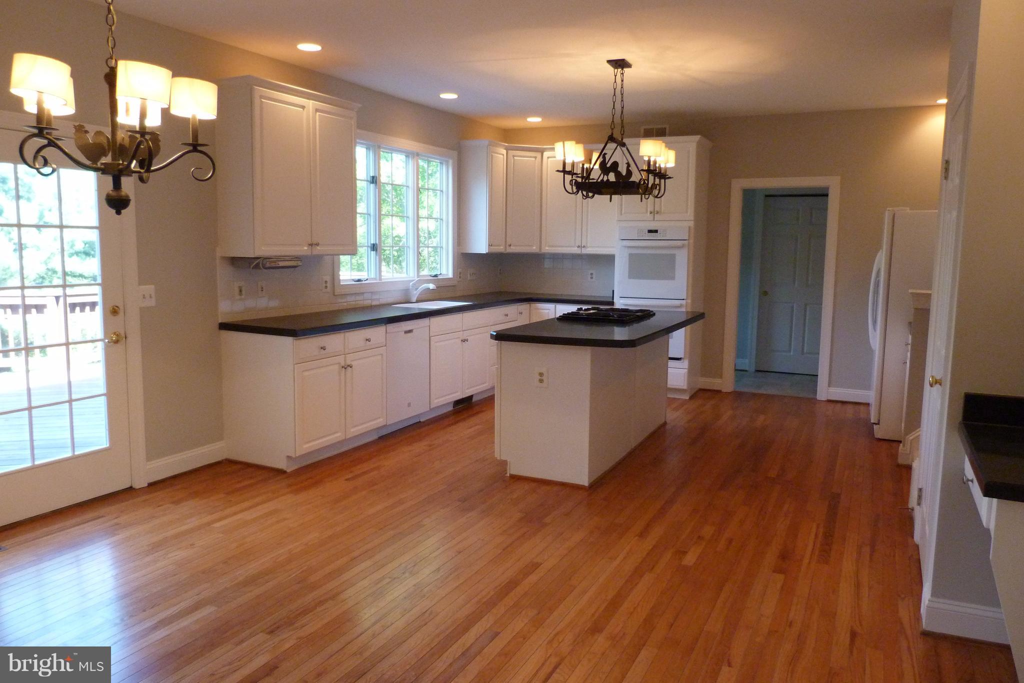 1716 Raleigh Hill Road Vienna, VA 22182 - Photo 6 of 30 Breakfast Nook to Kitchen w/ Granite/Doors to Deck