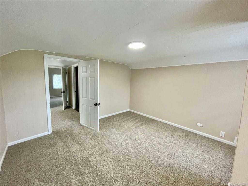 416 Old Maxton Road Raeford, NC 28376 - Photo 8 of 26 an empty room with an entryway and closet area