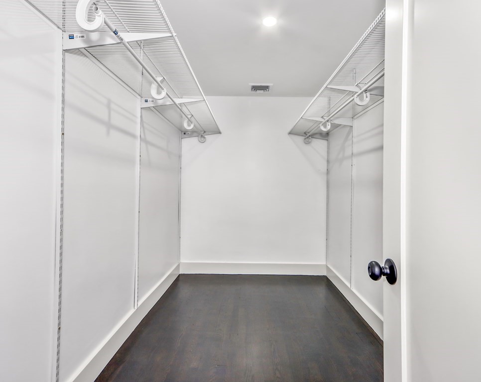 11 Spring Lane Saugus, MA 01906 - Photo 15 of 31 a view of a room with racks on the wall