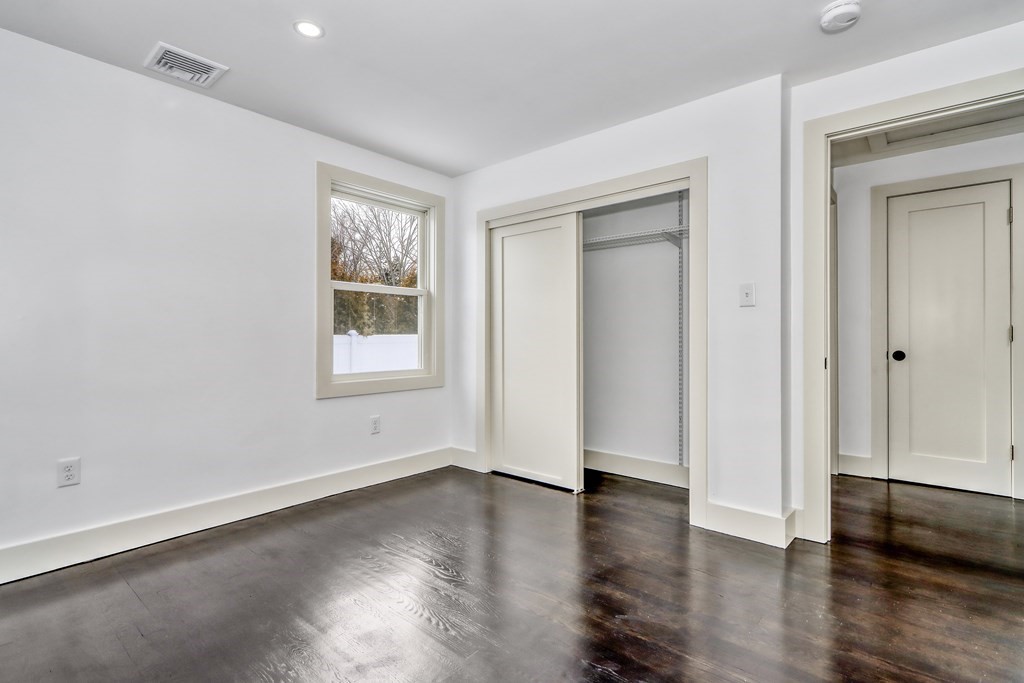 11 Spring Lane Saugus, MA 01906 - Photo 19 of 31 an empty room with wooden floor and windows