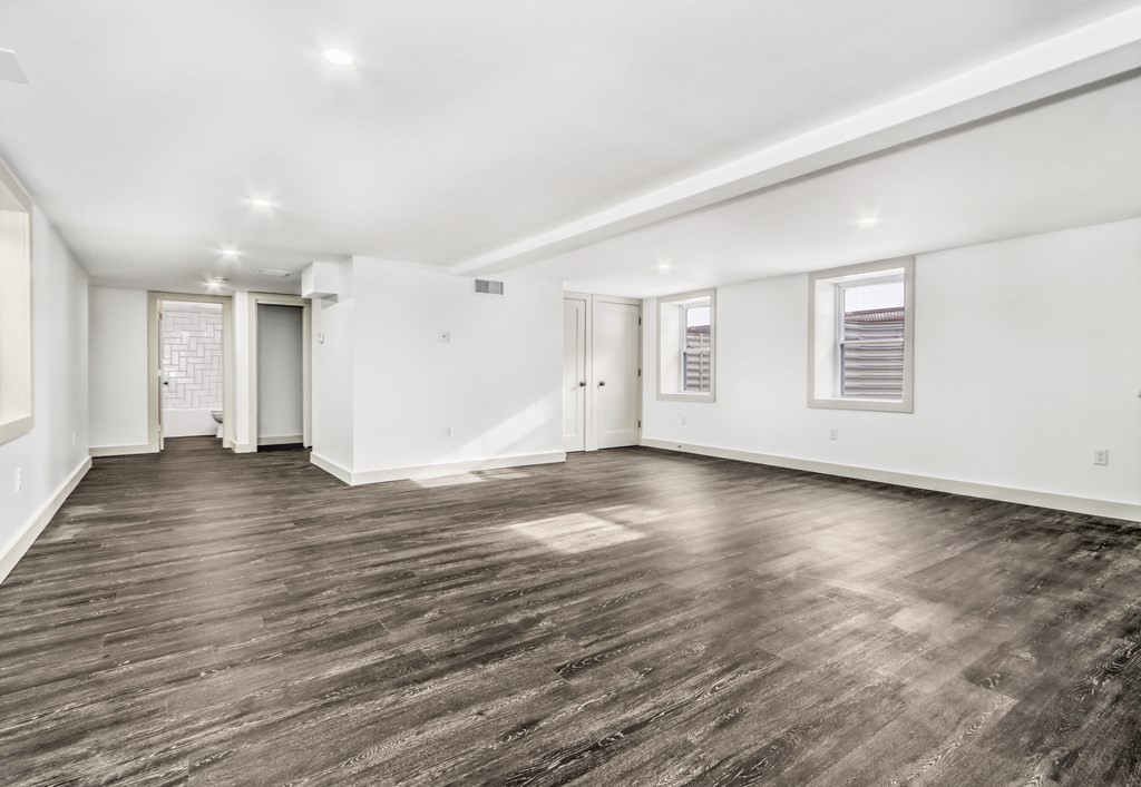11 Spring Lane Saugus, MA 01906 - Photo 23 of 31 an empty room with wooden floor and windows