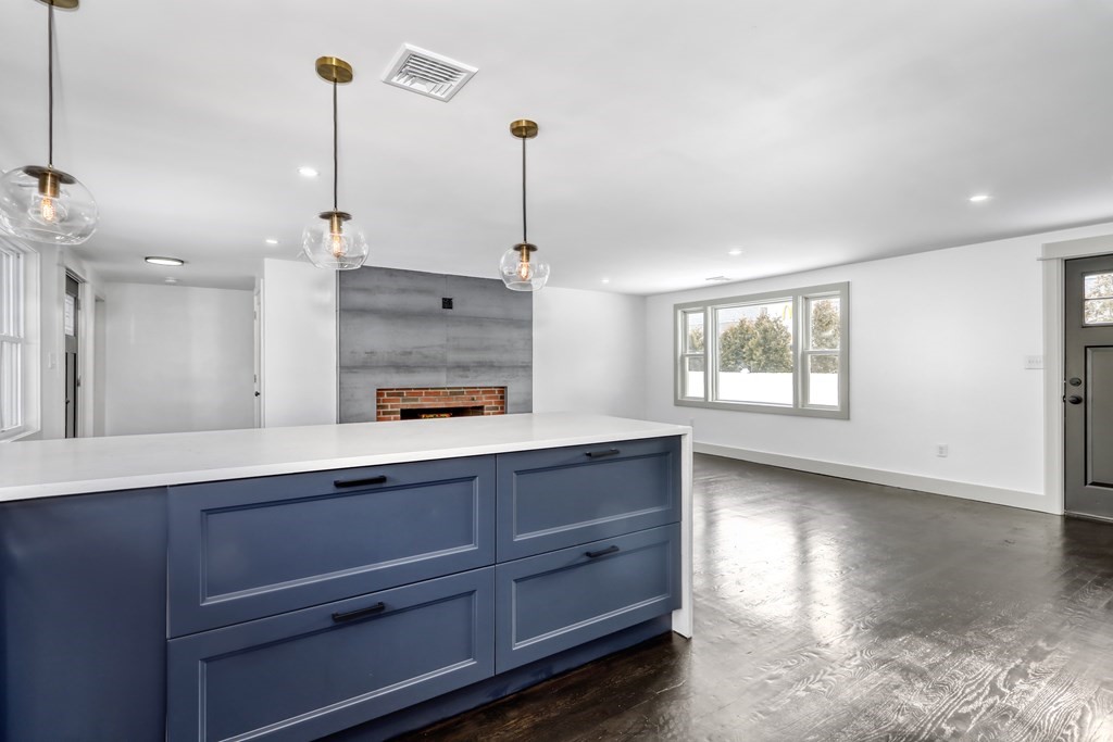 11 Spring Lane Saugus, MA 01906 - Photo 8 of 31 a living room with hard wood floors and a ceiling fan