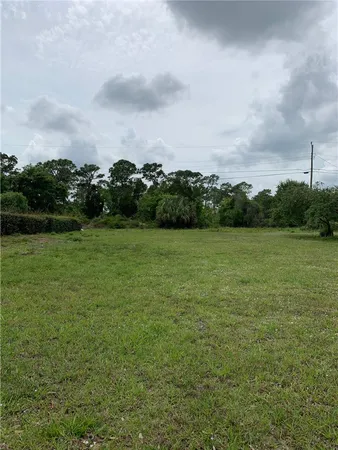 a view of a green field with clear sky