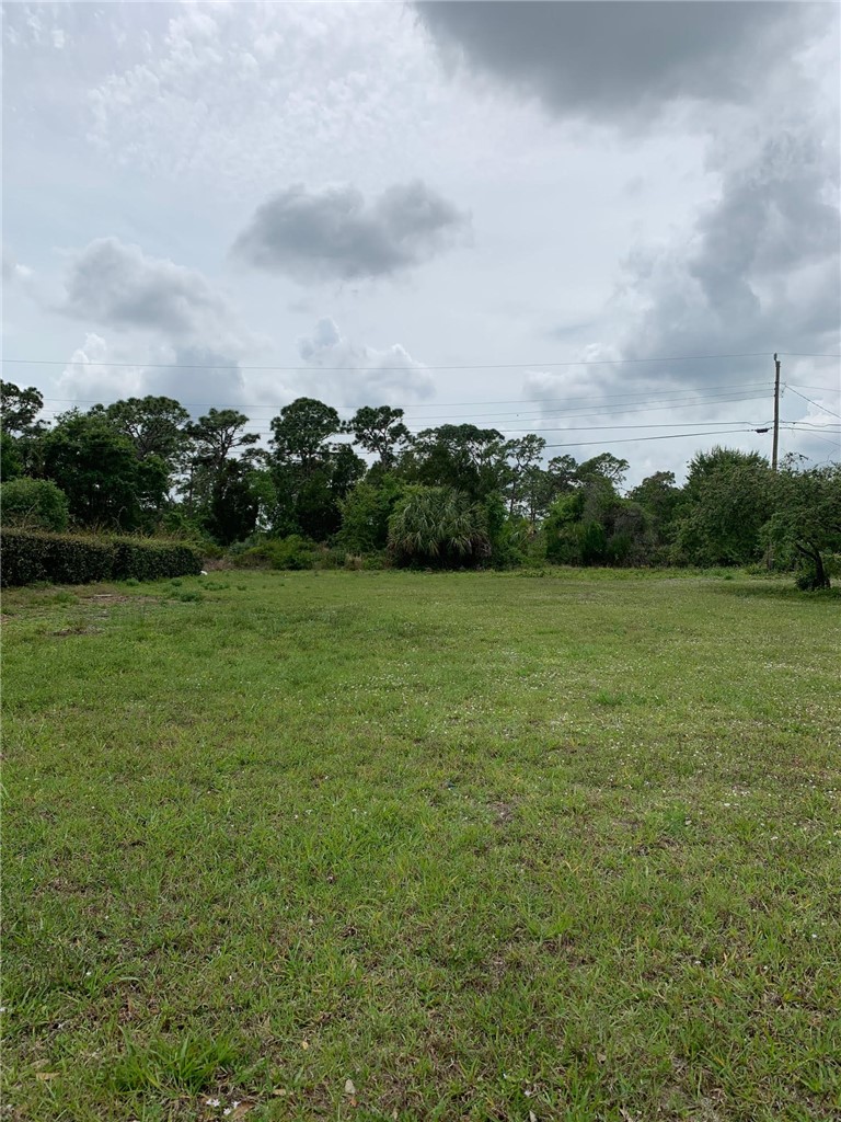 8065 126th Street Sebastian, FL 32958 - Photo 3 of 25 a view of a green field with clear sky