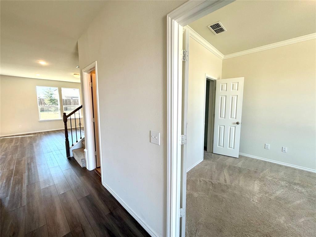 2006 Hummingbird Street Princeton, TX 75407 - Photo 8 of 23 a view of hallway with wooden floor