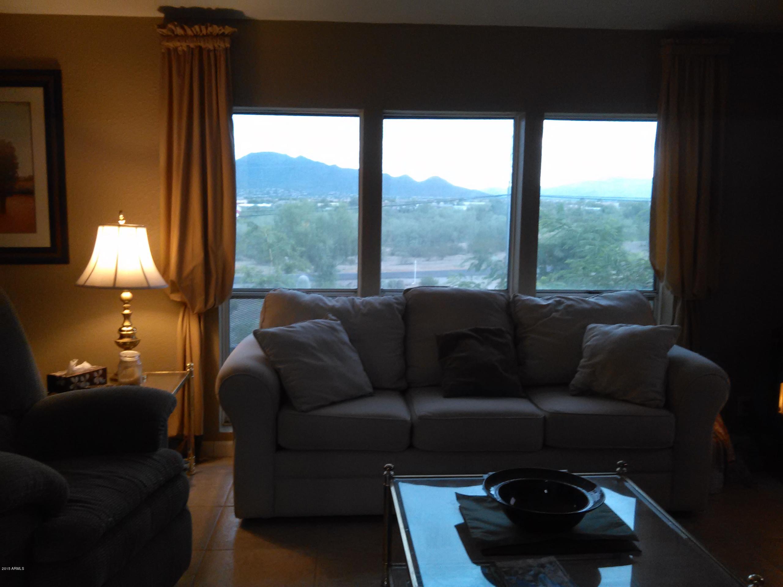 1829 West Irvine Road Phoenix, AZ 85086 - Photo 6 of 33 a living room with furniture and a large window