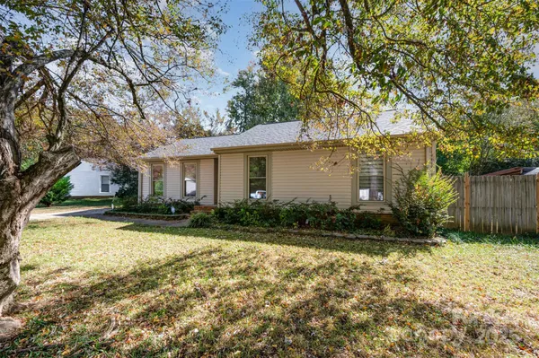 a front view of house with yard and green space
