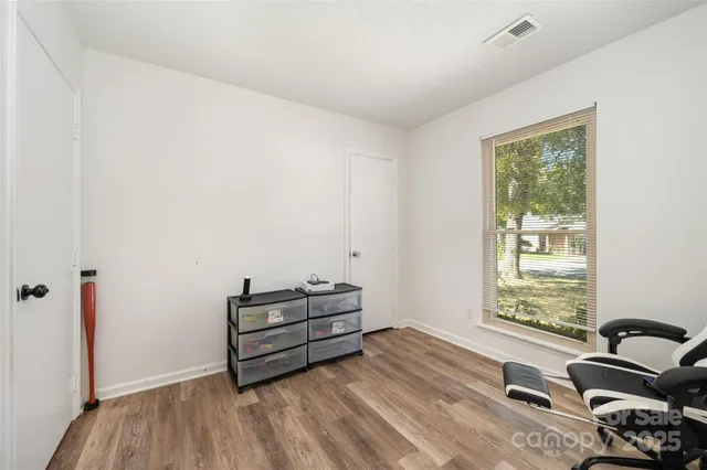 a backyard of a house with large trees
