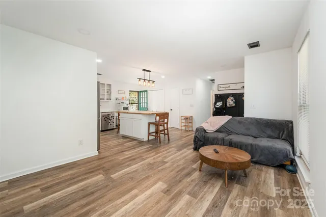 a bathroom with a sink vanity mirror and toilet