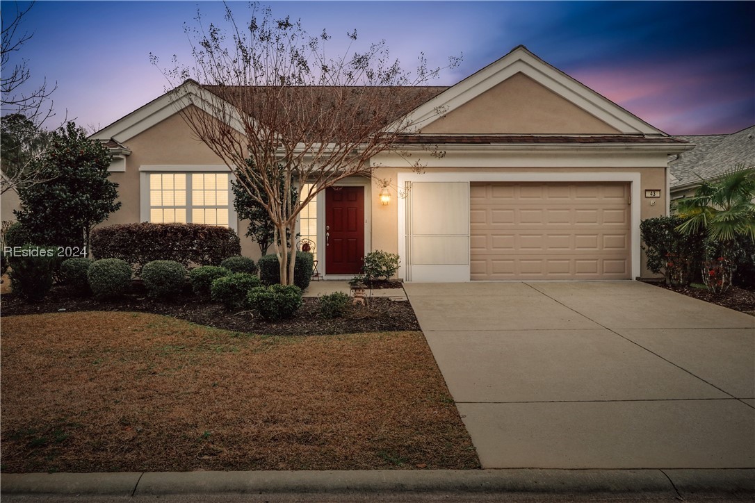 Ranch-style house featuring a garage