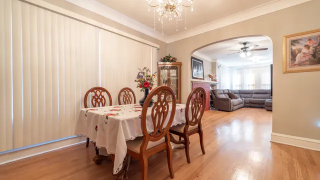 a dining room with furniture and wooden floor