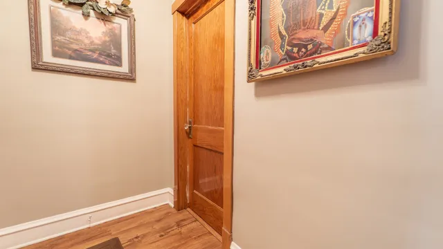 a view of a door with wooden floor